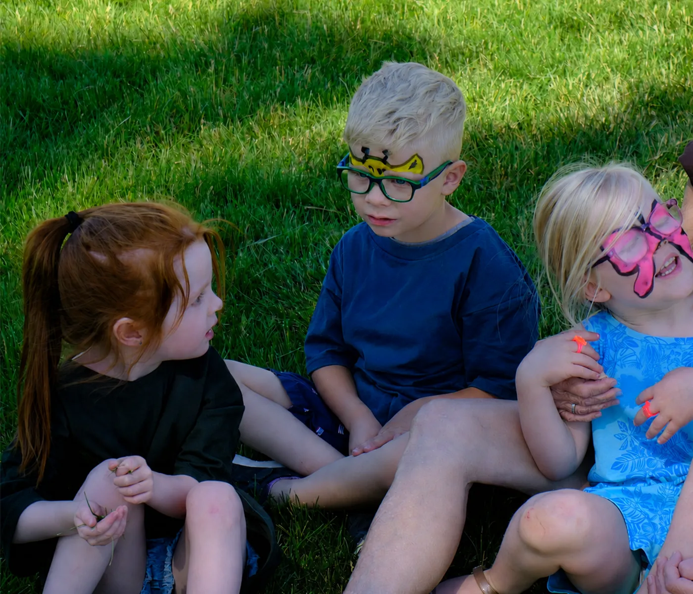 Children sitting outside during BridgeKids kids ministry at Bridge Helena in Helena Montana